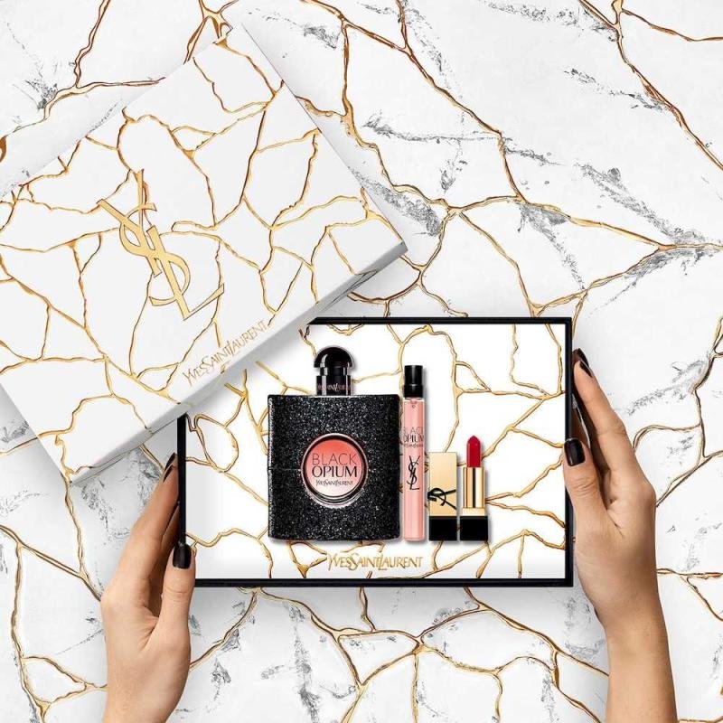 BLACK OPIUM 4PC SET BY YVES SAINT LAURENT: 3.0oz edp sp0.11oz rouge volupte shine lipstick0.06OZ. MASCARAPOUCH FOR WOMEN